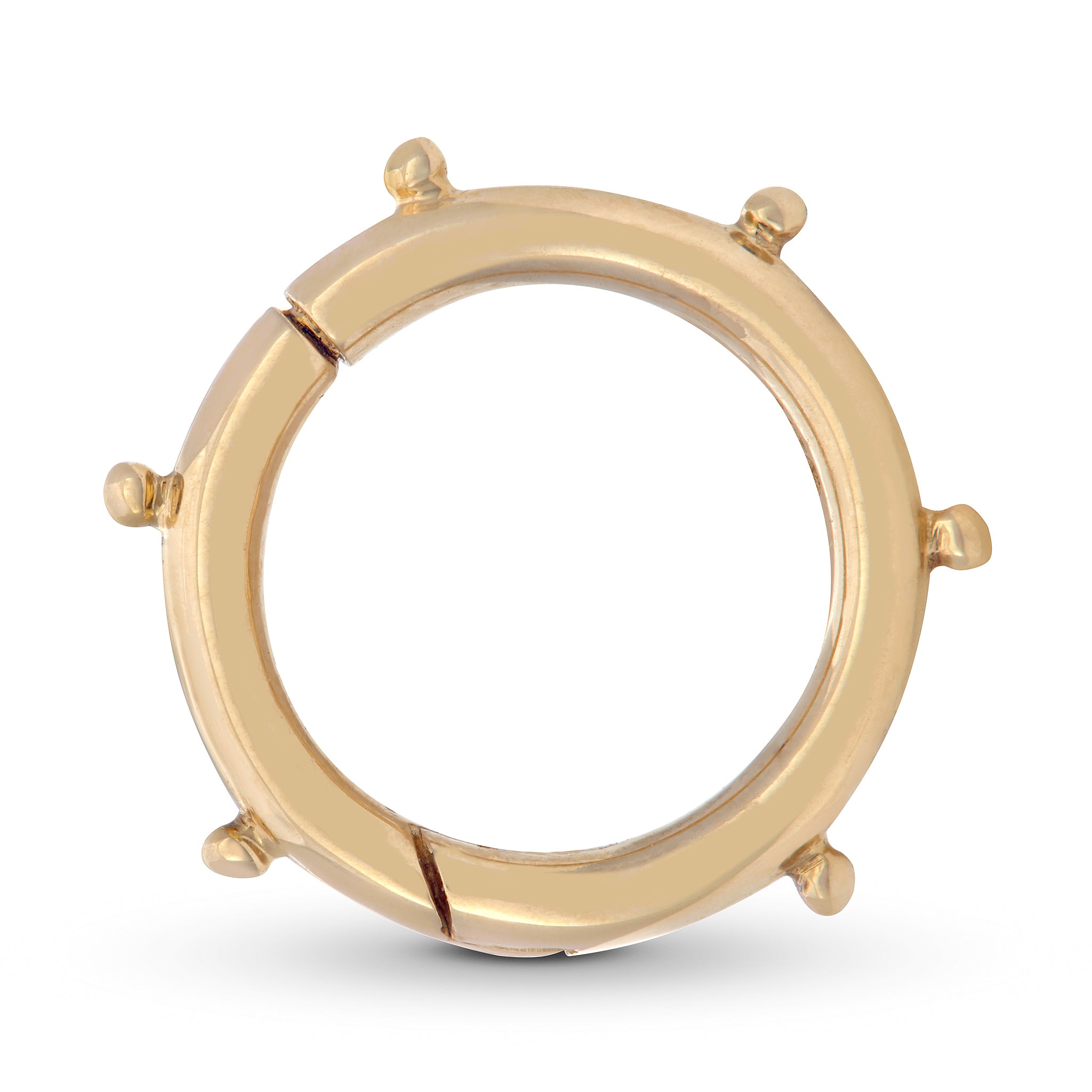 A 14K gold circle clasp with a snap closure, featuring dots on the inner edge and gold accents designed by Maura Green