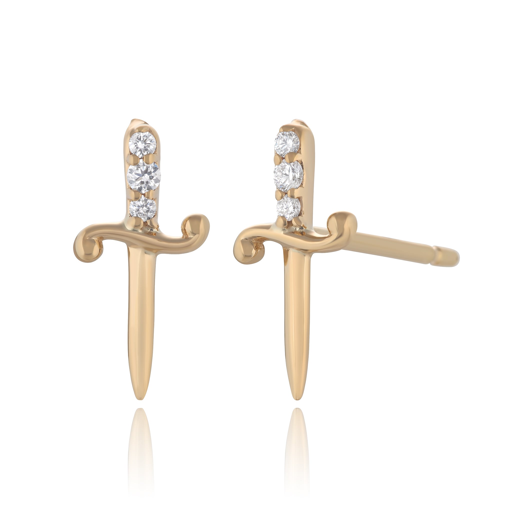 Yellow gold and diamond stud earrings shaped like daggers against a white background by Maura Green