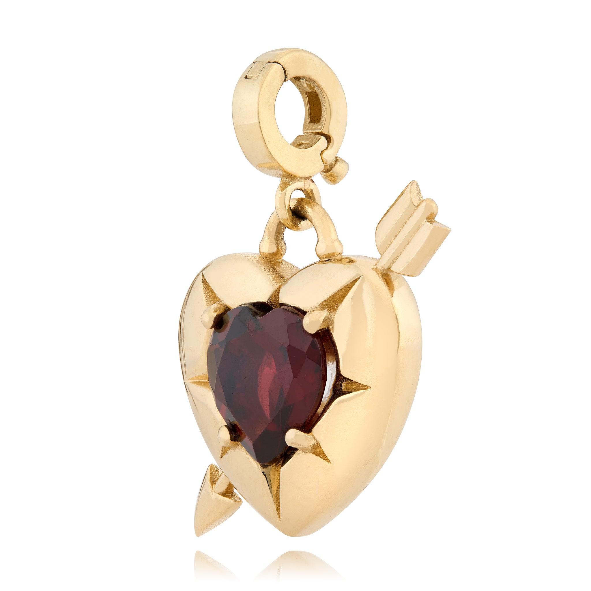 14K Gold heart charm with a red garnet in the middle and a gold arrow going through the heart, designed by Maura Green