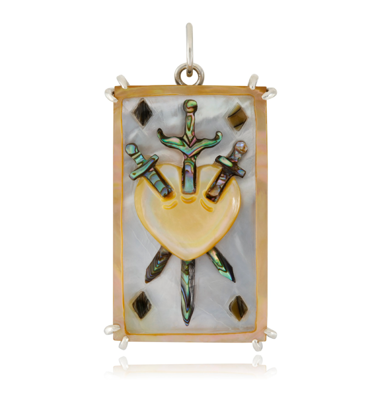 A sterling silver pendant featuring a hand-carved abalone and mother of pearl in the shape of the Three of Swords tarot card, designed by Maura Green.