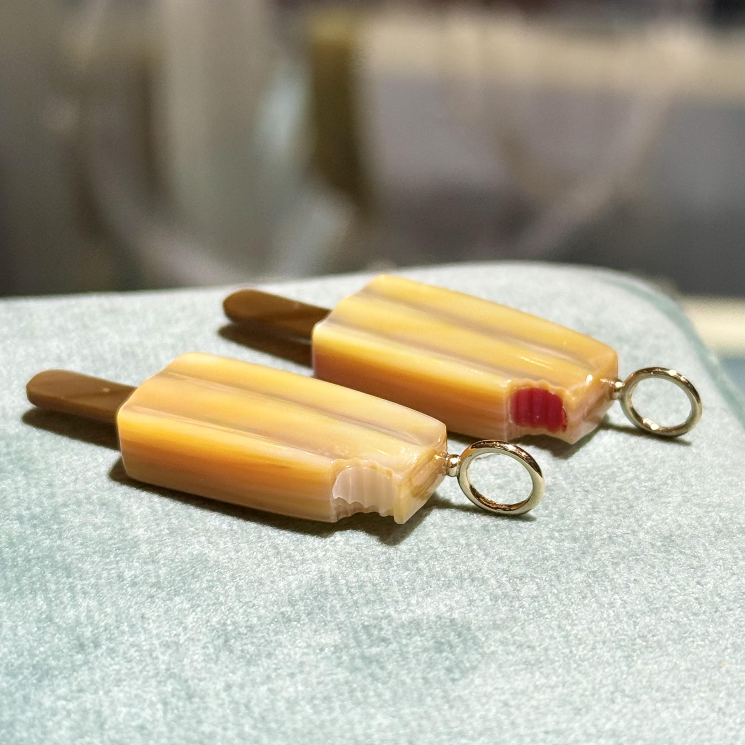 Popsicle-shaped charms with a gold bail. Designed by Maura Green