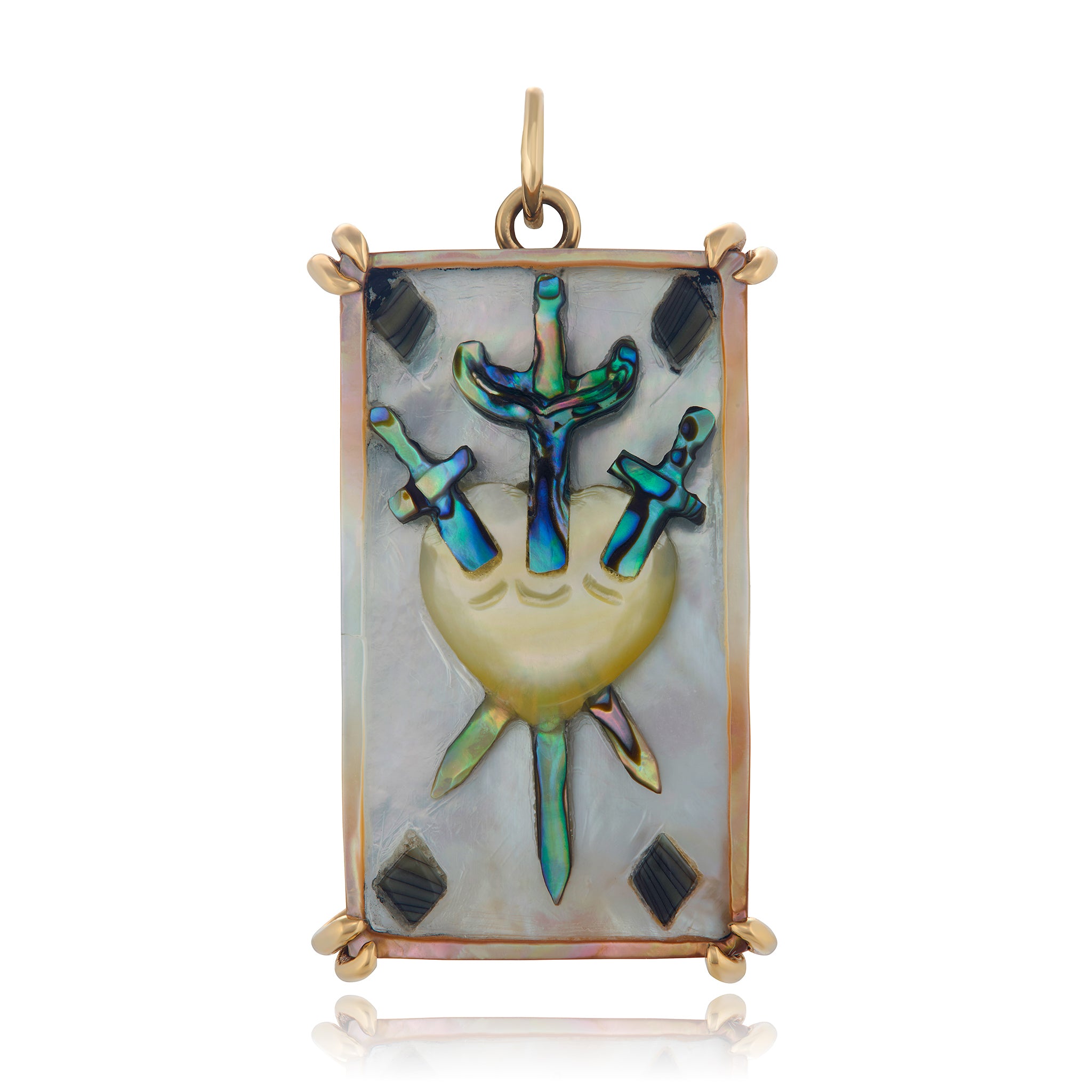 A 14K gold Tarot card pendant with a hand-carved abalone and mother of pearl design, featuring the Three of Swords symbol. Designed by Maura Green.