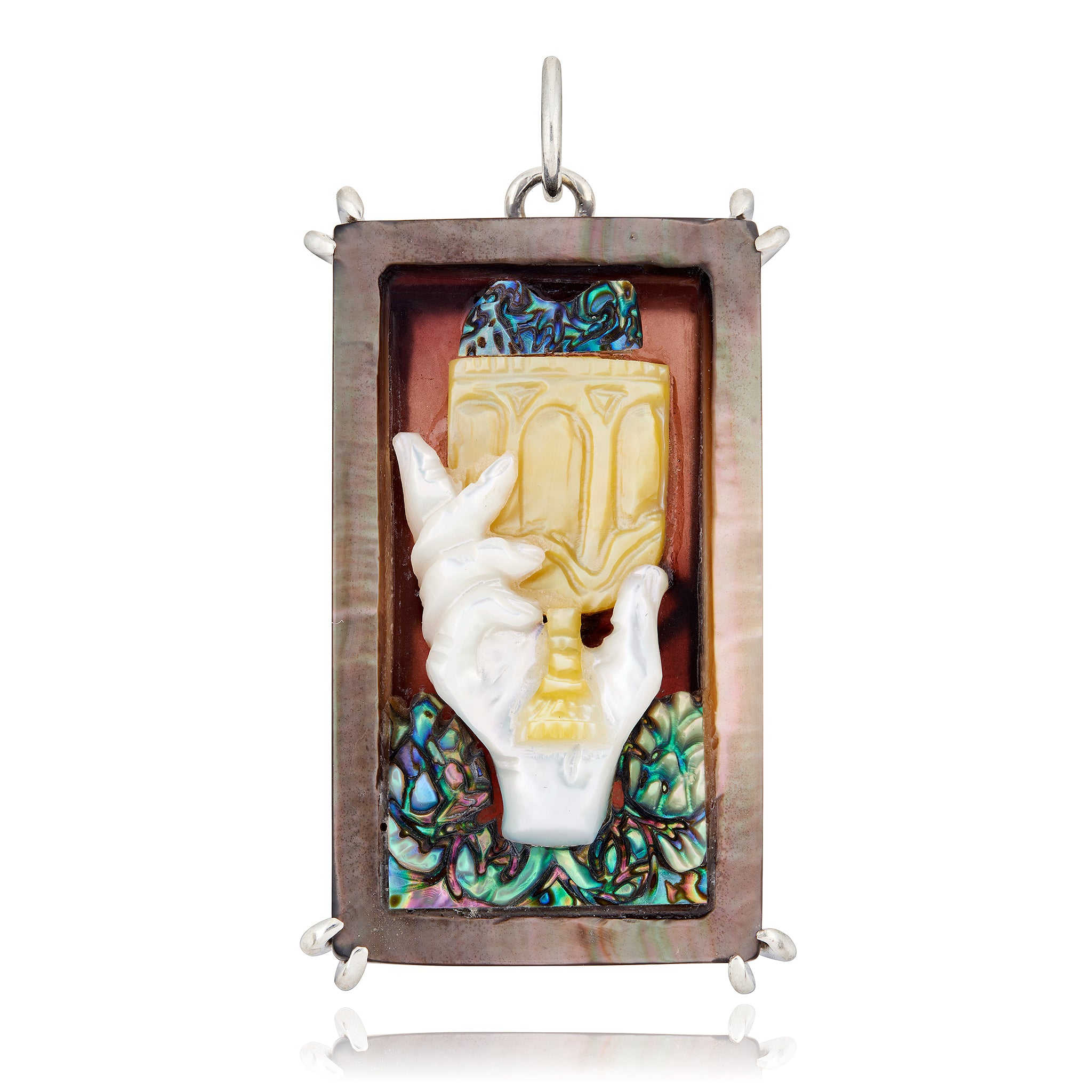 Decorative rectangular pendant with hand holding a chalice design on a white background representing the Ace of Cups tarot card designed by Maura Green
