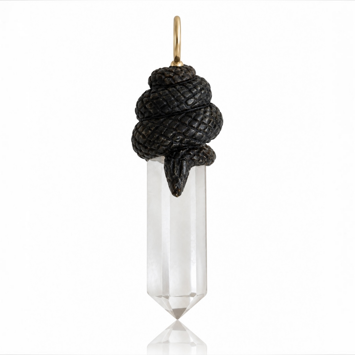 Hand-carved black mother-of-pearl snake coiled around a faceted clear chalcedony crystal point, finished with a 14K yellow gold bail.