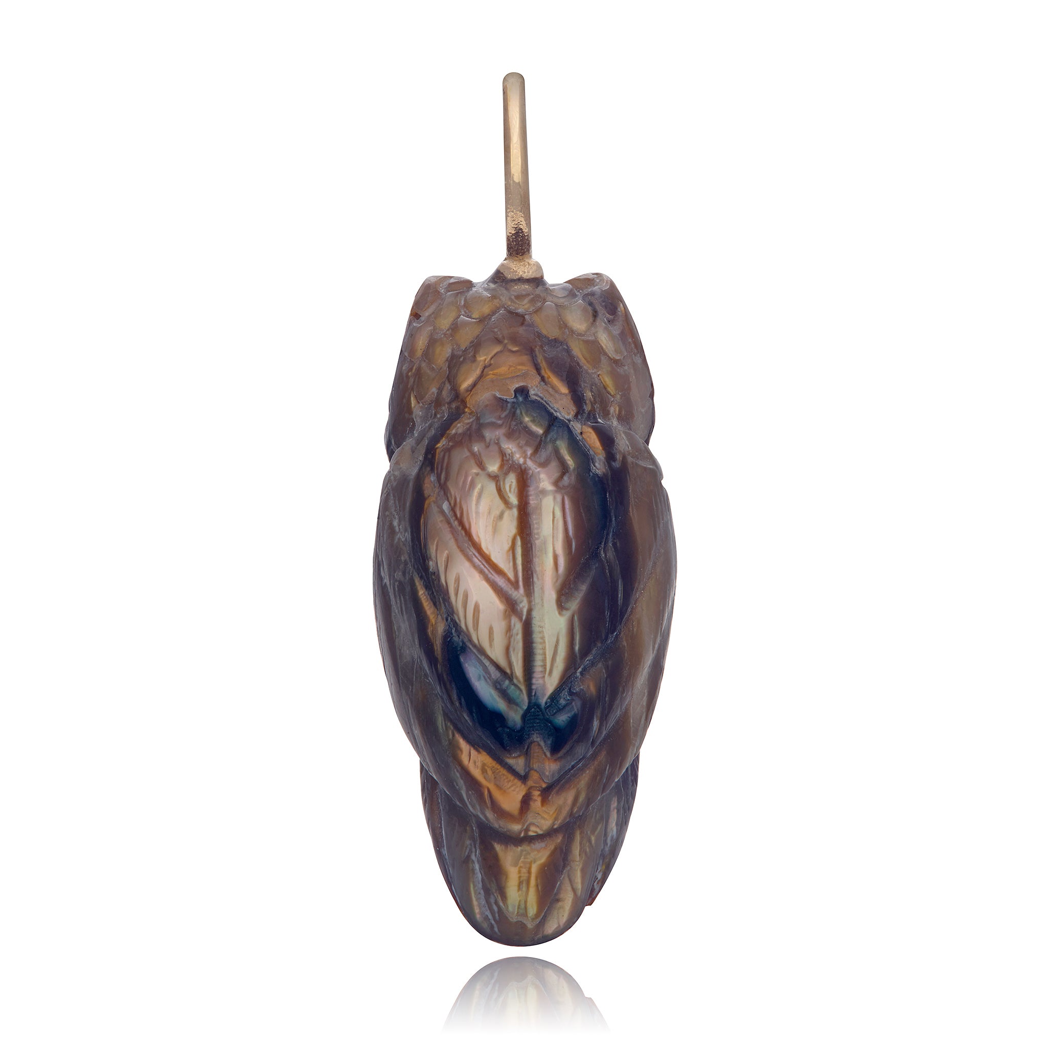 The back view of a 3d carved copper colored owl charm with a gold bail designed by Maura Green, in front of a white background.