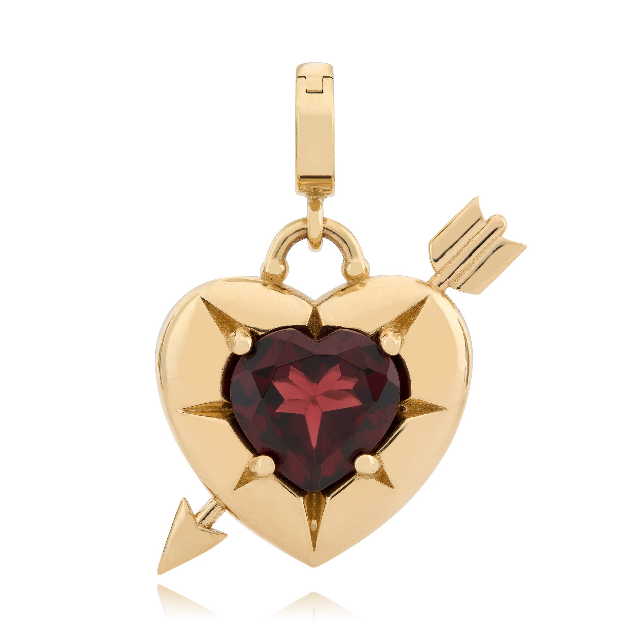14K Gold heart charm with a red garnet in the middle and a gold arrow going through the heart, designed by Maura Green