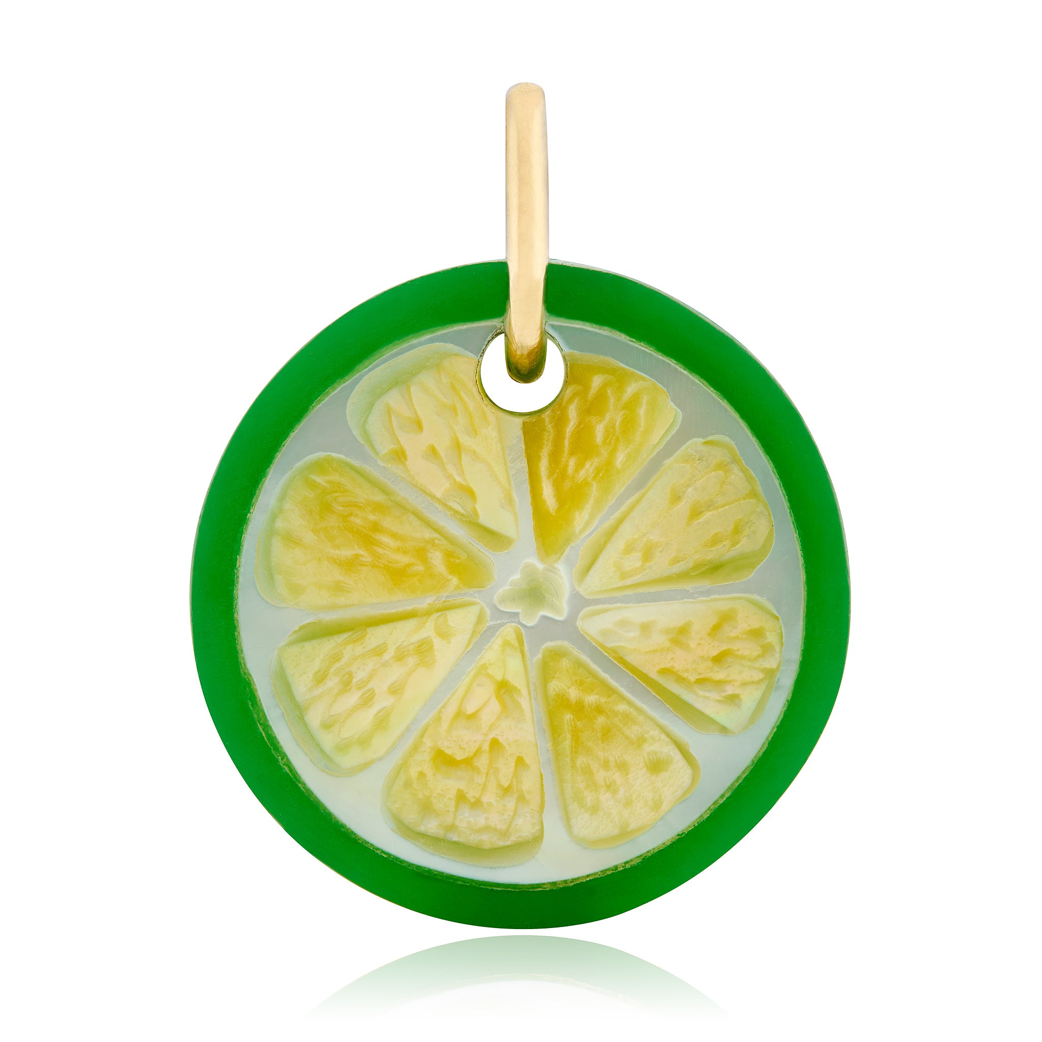 A realistic hand carved green lime slice charm with a 14K yellow gold bail against a white background. Designed by Maura Green.
