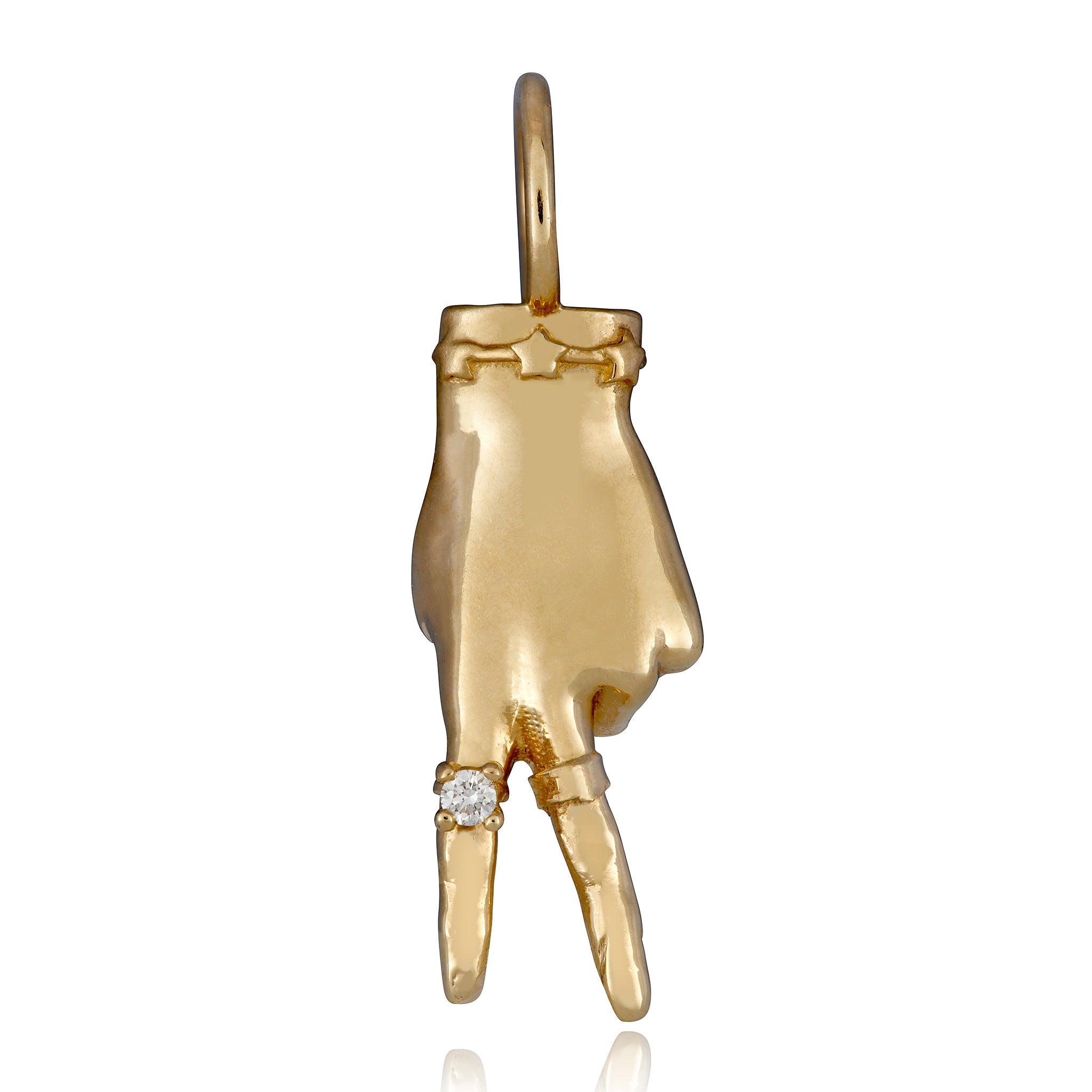 A 14k gold charm in the shape of a hand making a peace sign gesture, with a small diamond ring on the finger designed by Maura Green against a white background.