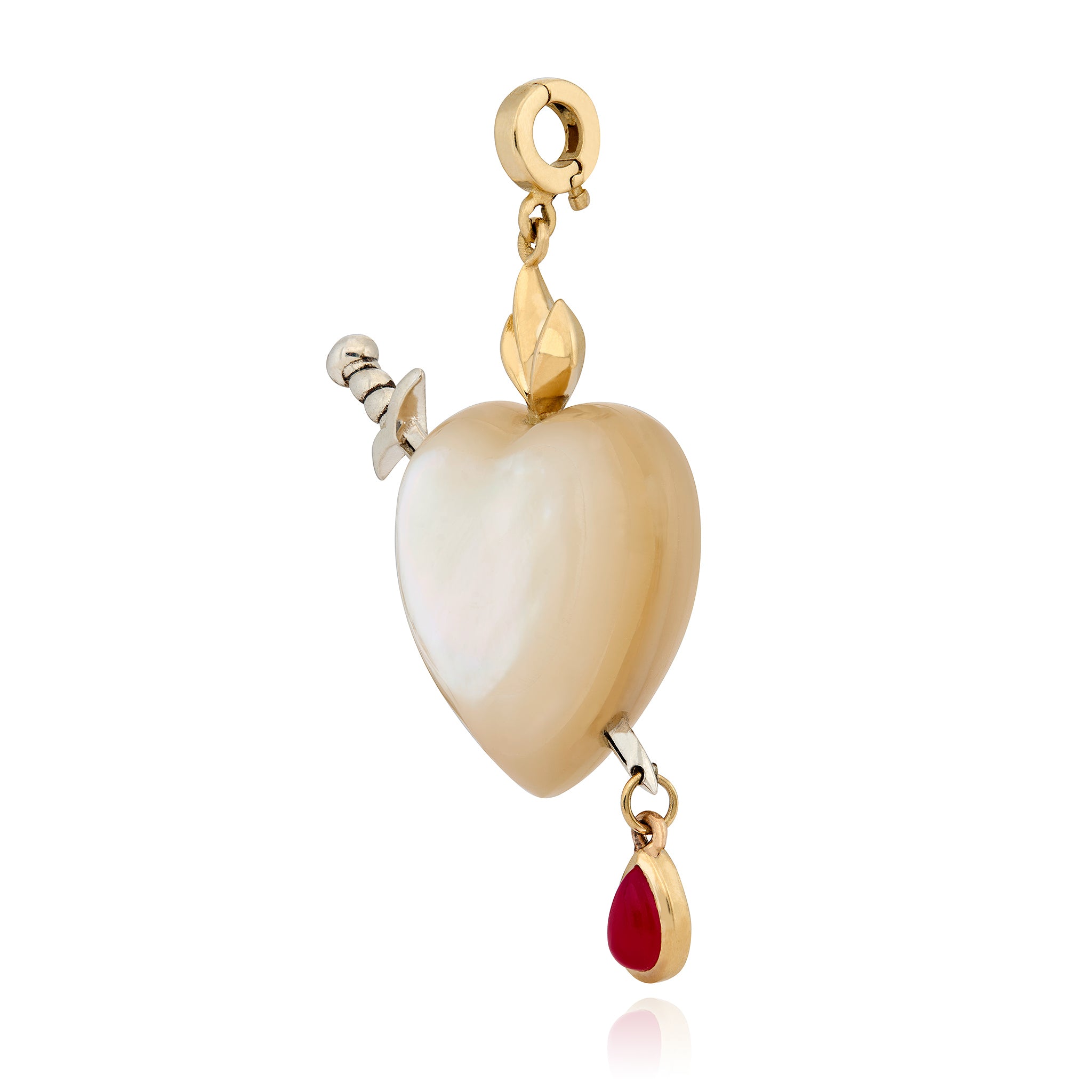 Maura Green Jewelry Sacred Heart Charm in white mother of pearl, with a silver sword, gold flames, and a dangling ruby. Shown in a 3/4 view.