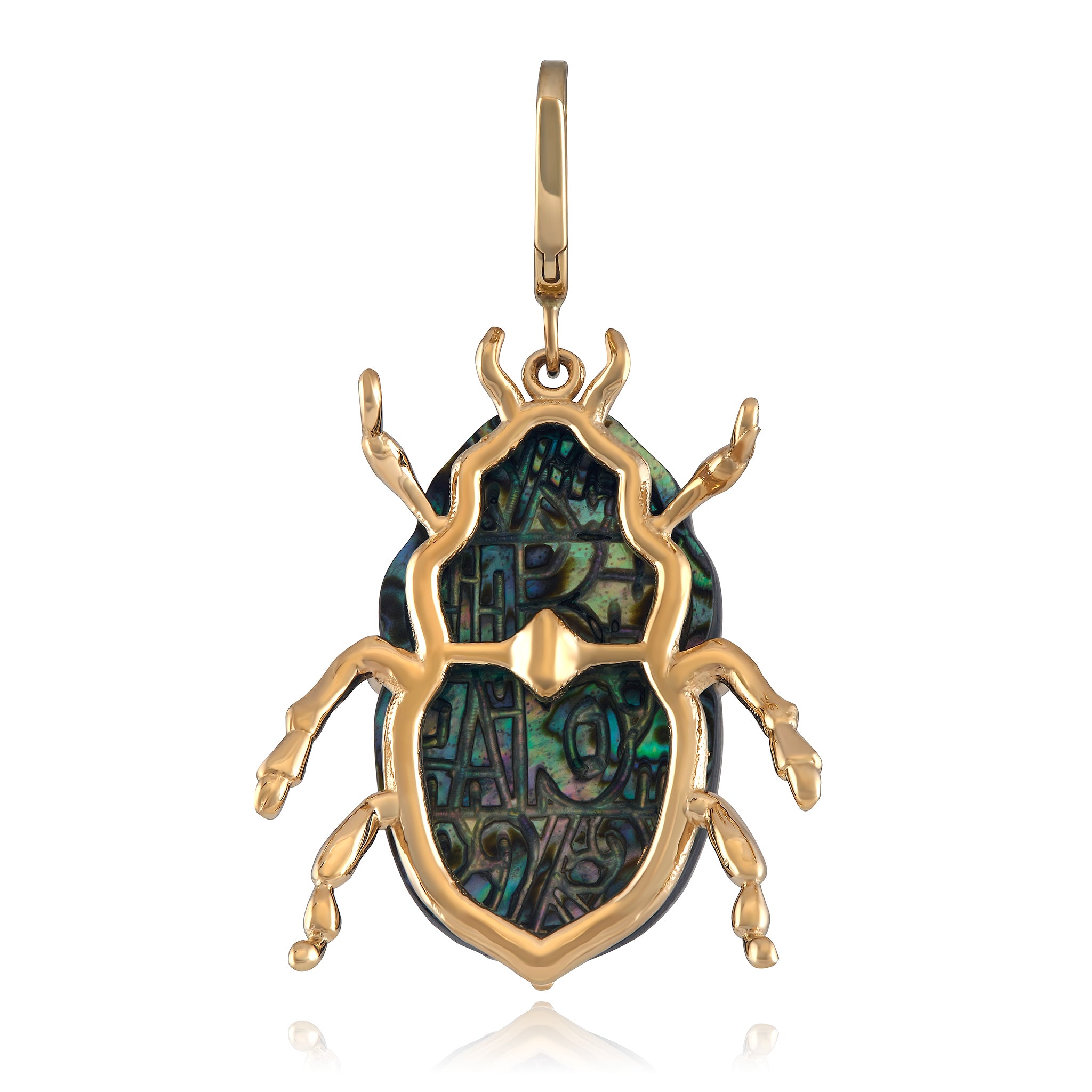 The back of A Maura Green luminescent scarab beetle charm with a combination of blue and green colors, set in a gold frame with a diamond accent.