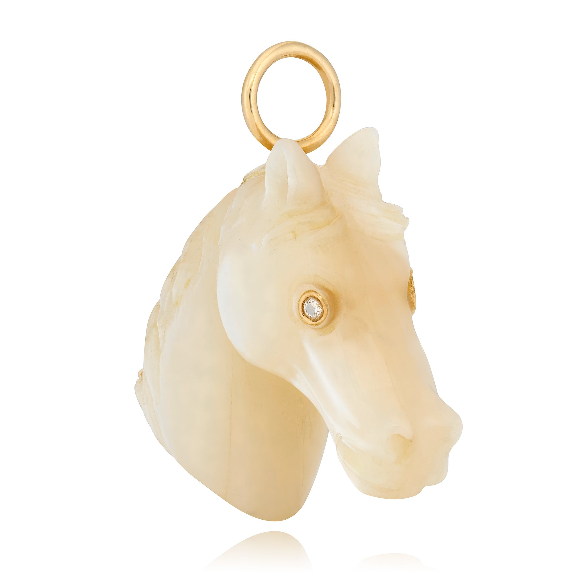 Gold pendant with a horse head design on a white background