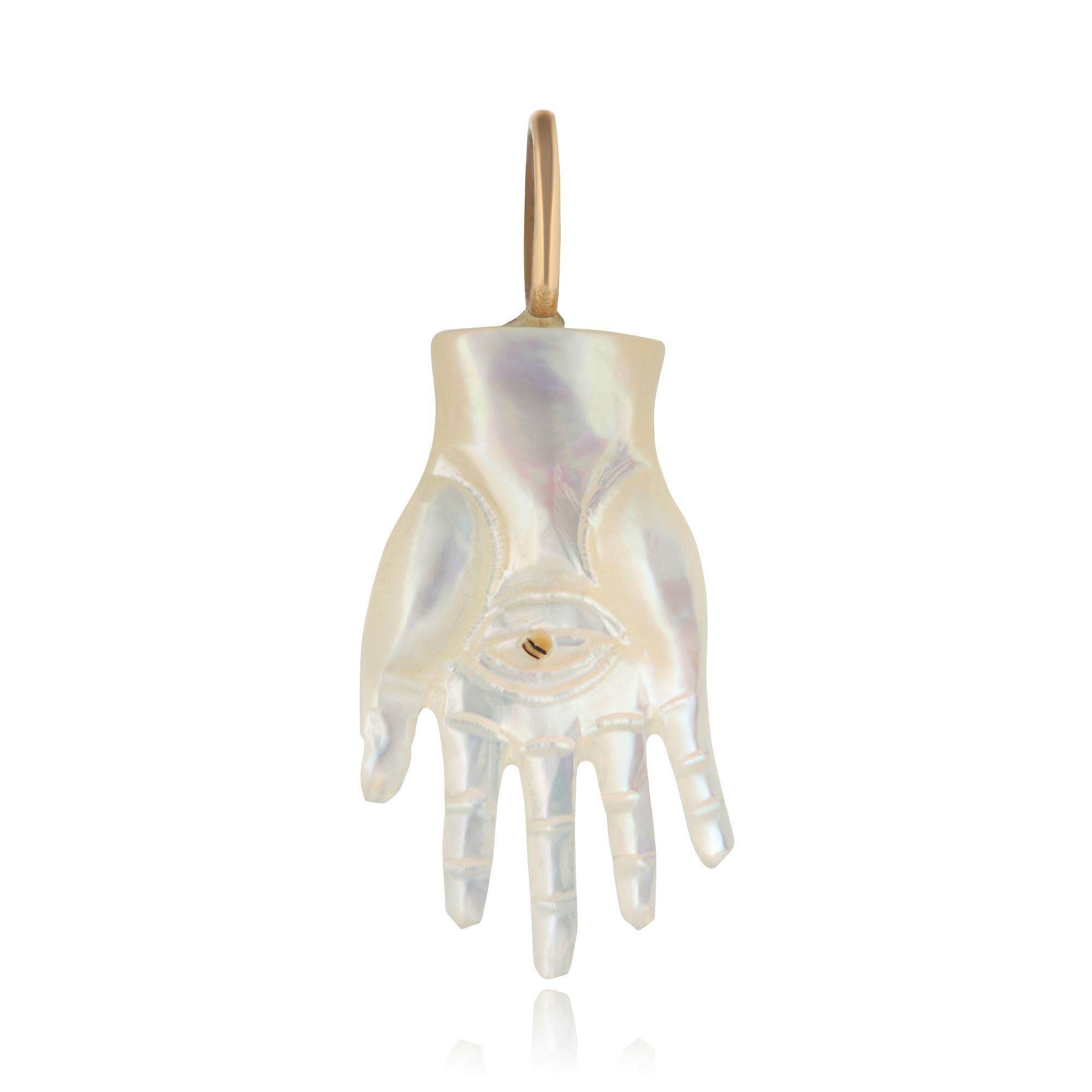 A carved mother of pearl Hamsa hand with a 14K gold bail designed by Maura Green 