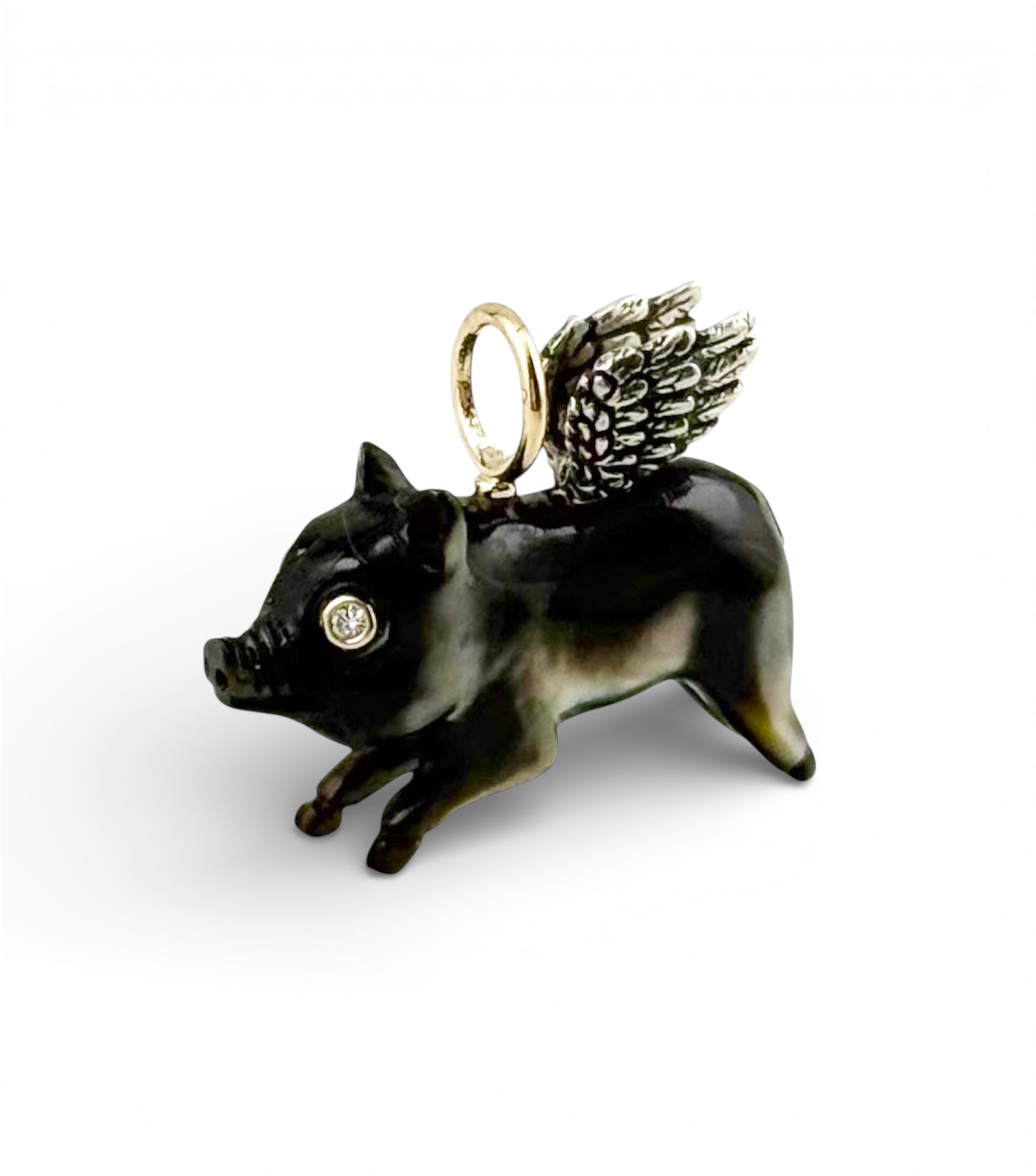 Decorative flying pig charm with silver wings and diamond eyes designed by Maura Green