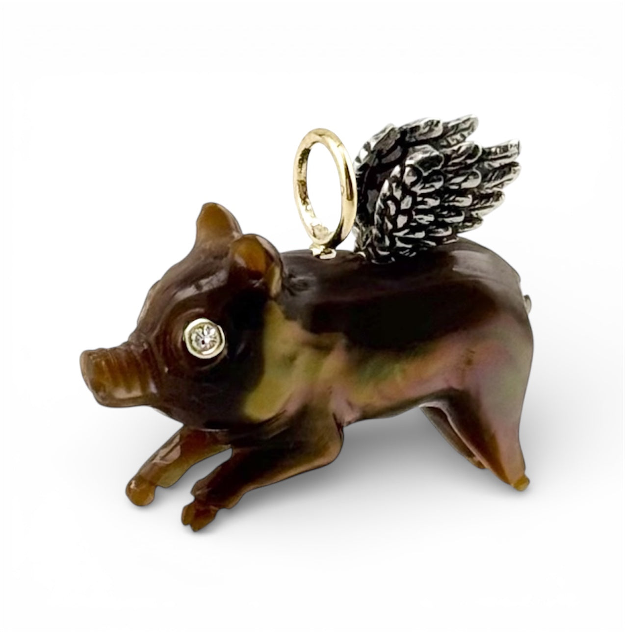 Decorative flying pig charm with a gold, diamonds, and silver wings designed by Maura Green