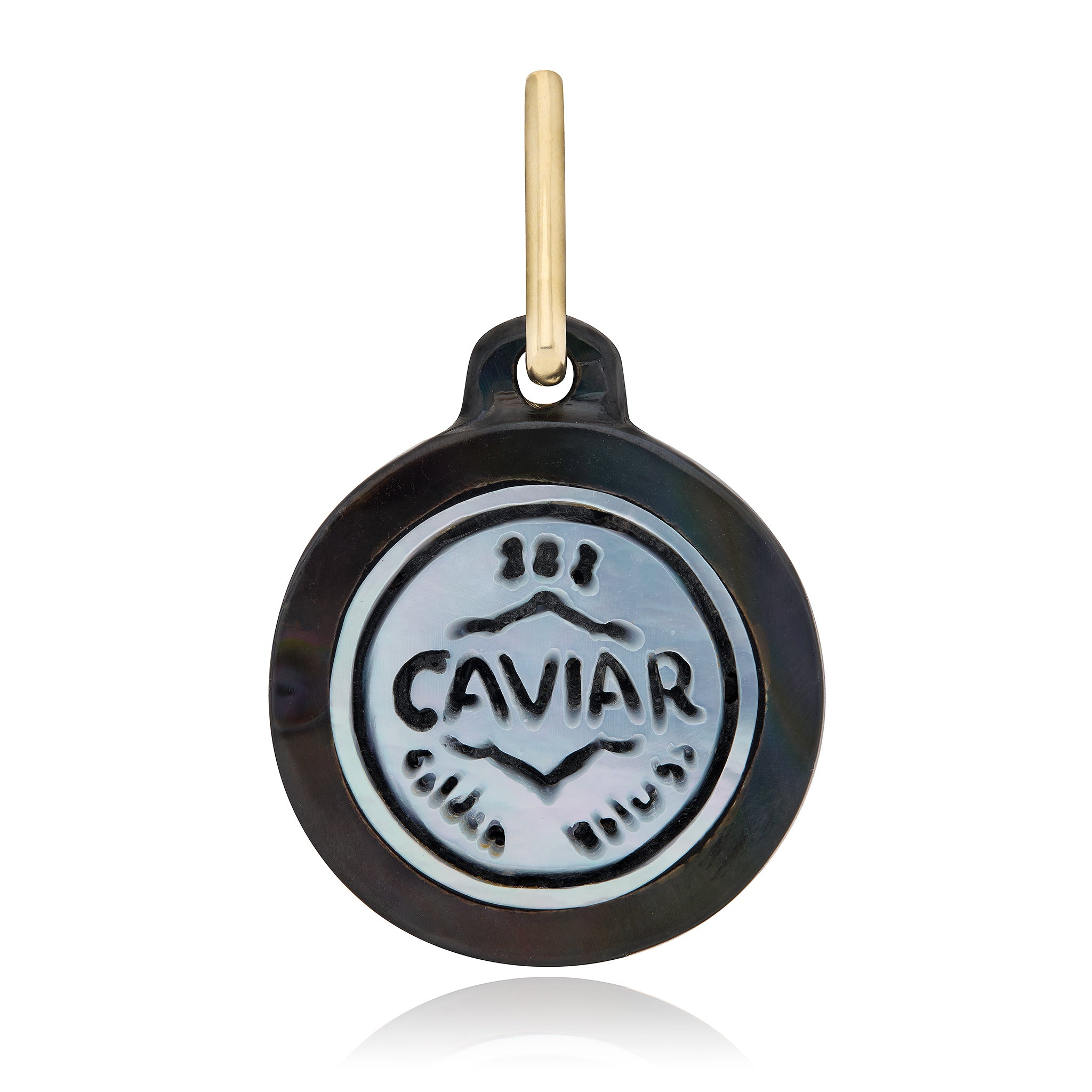 A round black and silver caviar-themed pendant with a gold hanging loop, shown on a white background designed by Maura Green Jewelry.