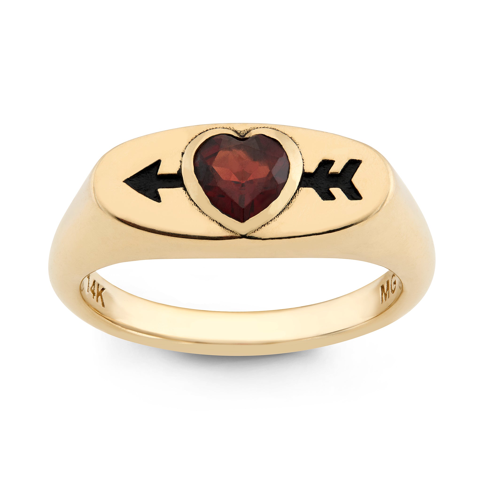 Gold ring with a red heart-shaped garnet with an arrow going through it. Designed by maura green