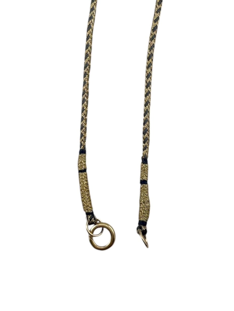 blue and gold braided silk cord Necklace with a circular 14K gold clasp designed by Maura Green