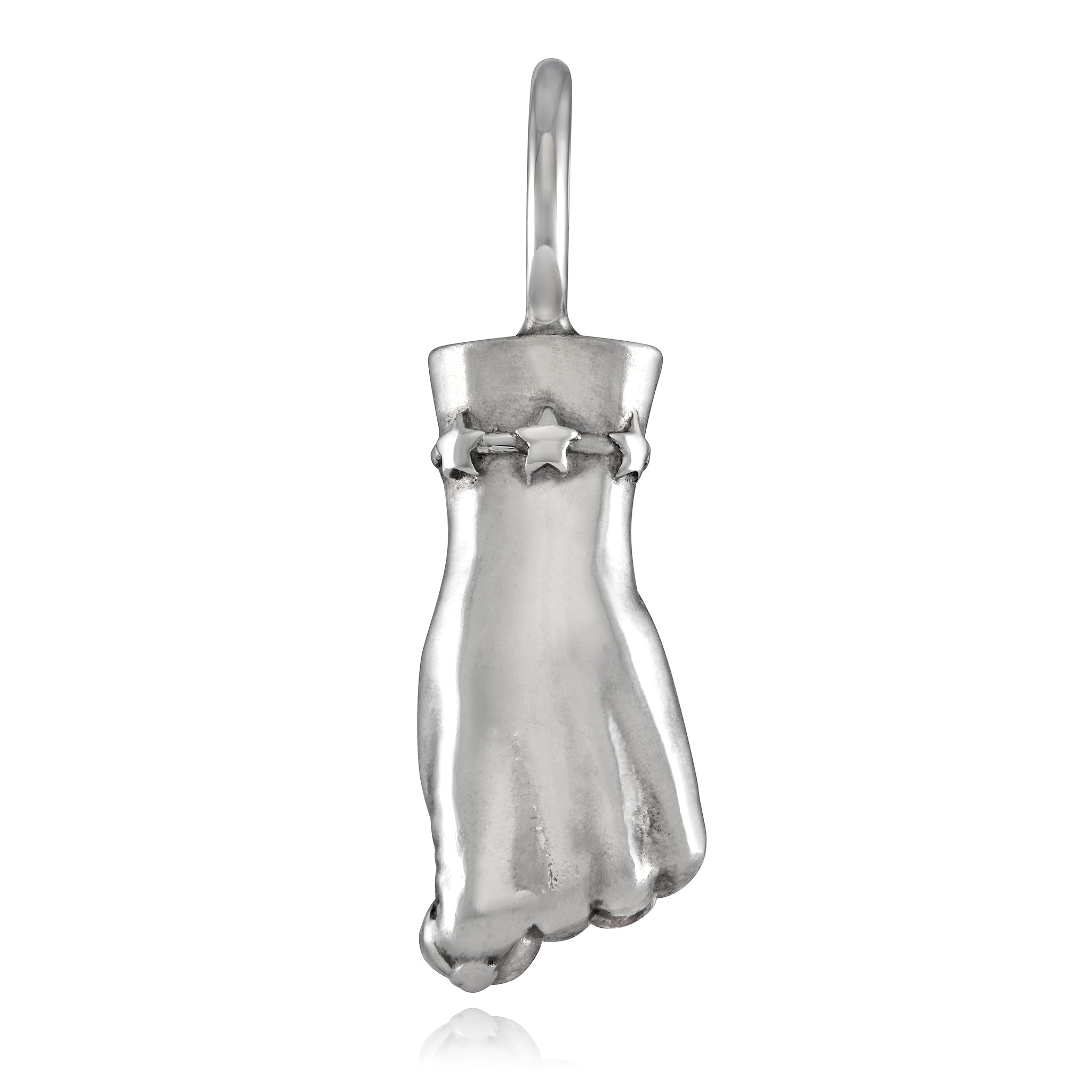 A silver-colored figa charm in the shape of a female hand, with a star detail on the wrist designed by Maura Green Jewelry for her ladyfinger collection.