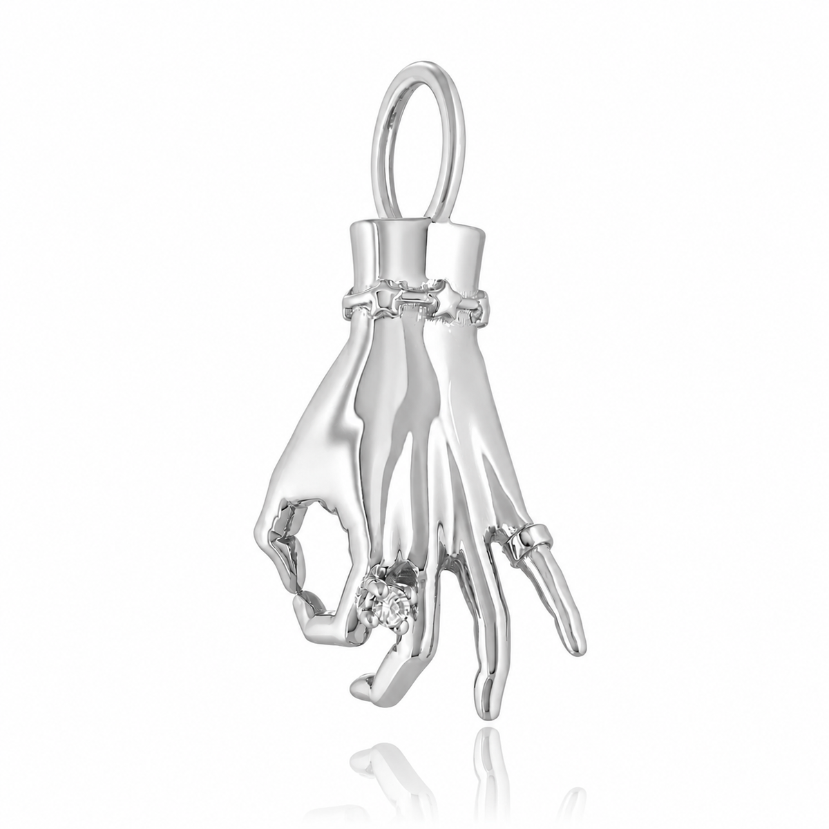 A white gold ladyfinger charm with a diamond ring on the index finger, attached to a delicate gold chain. Designed by Maura Green